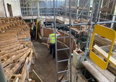 Photo of the Bandstand stage being built, with contractor giving thumbs up